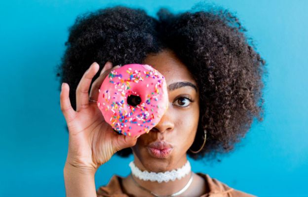 summer intern eating hurts donuts in wichita, kansas