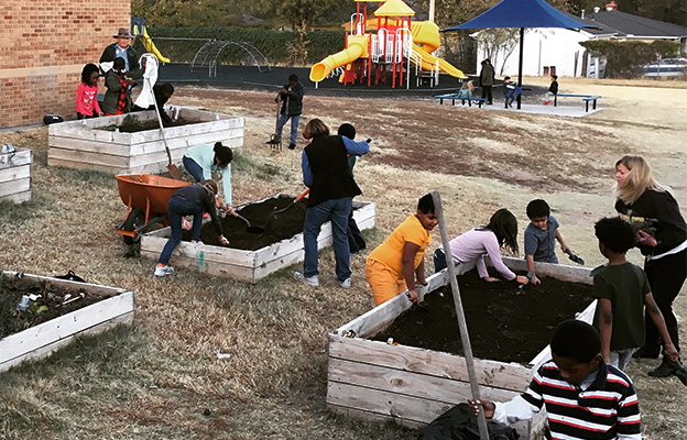 kids helping with local business nudge compost in wichita kansas