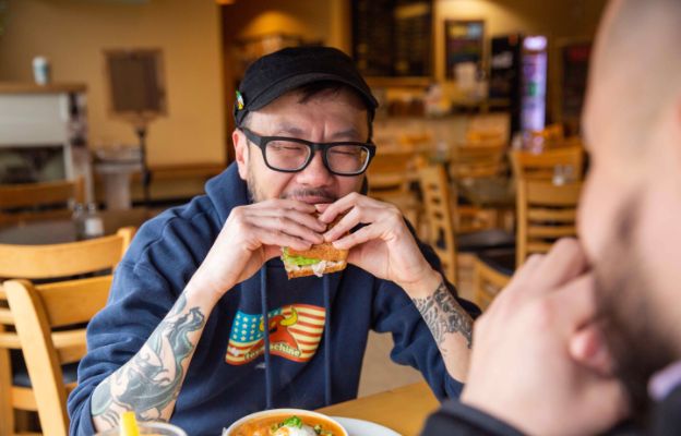 eating sandwich at tanyas soup kitchen in downtown wichita kansas