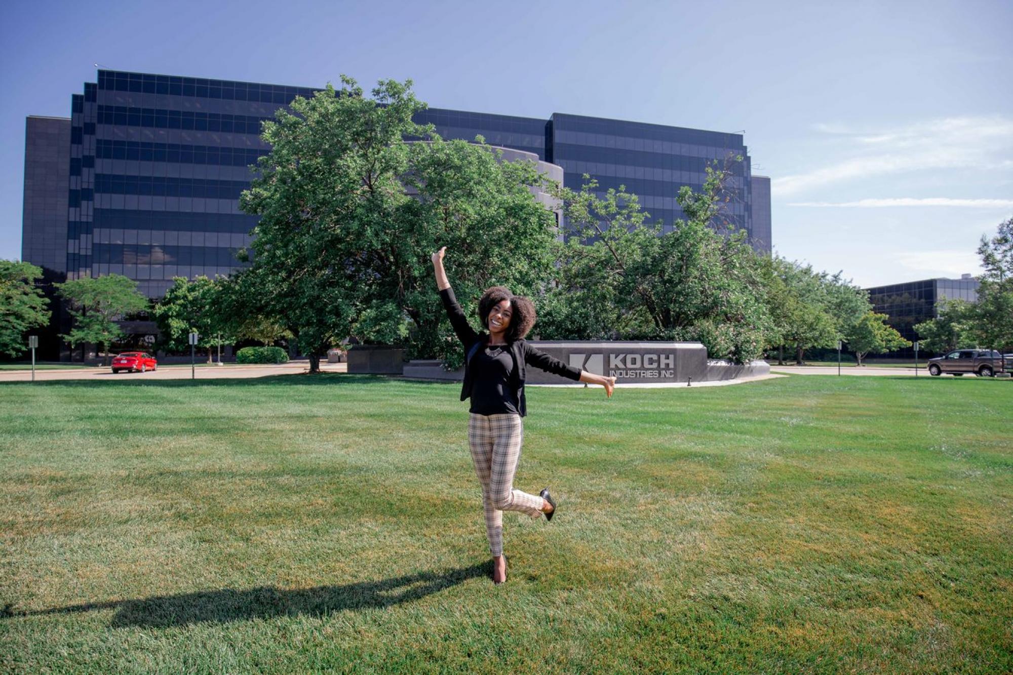 posing outside of koch industries headquarters in wichita, kansas